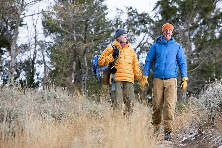 People hiking down a trail